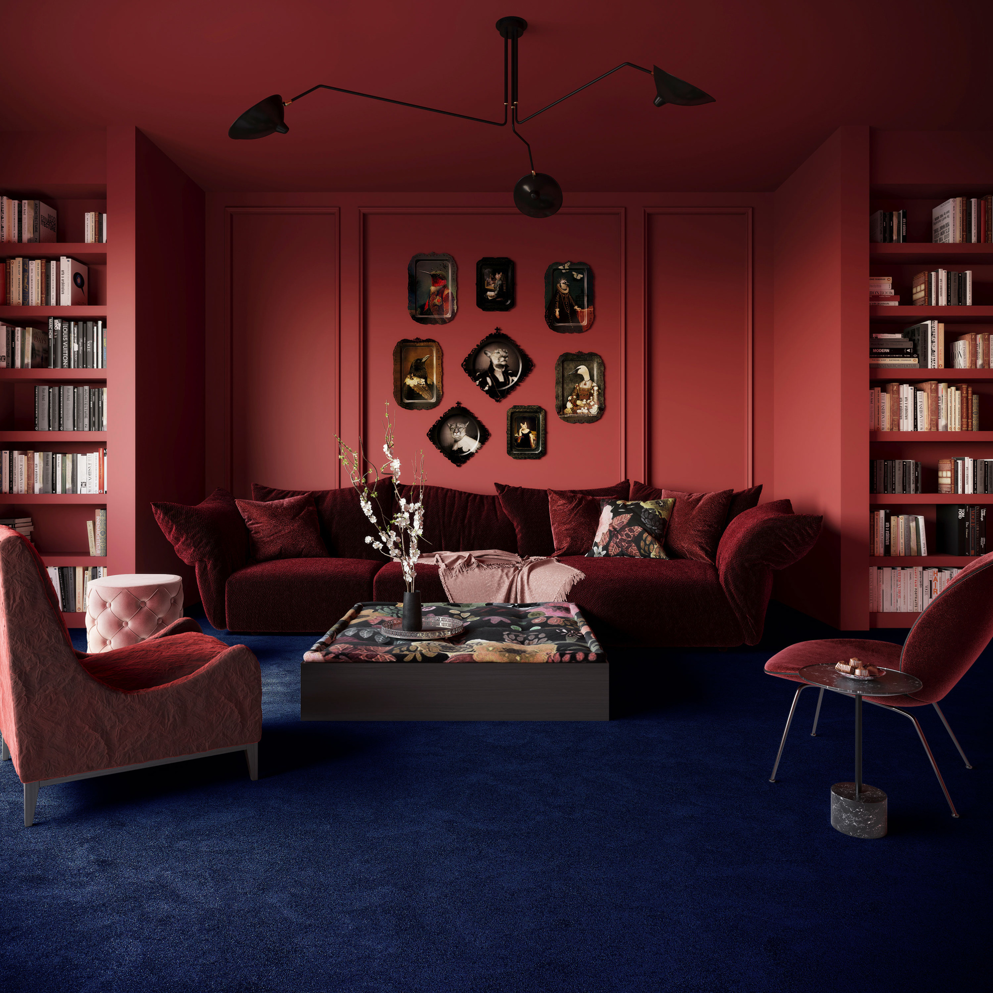 Salon à l’atmosphère feutrée où la moquette Chroma Sense Encre bleue adoucit le contraste des murs rouges