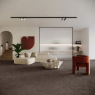 Moquette éco-conçue Infini 11.5 - Marron tonka apportant confort et chaleur à un intérieur contemporain