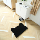 Tapis d’entrée déco Chat - Fibre de Coco 17mm - Noir en forme de tête de chat sur parquet clair