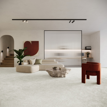 Moquette Infini 11.5 - Gris urbain associée à un mobilier design pour un intérieur moderne et apaisant
