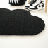 Tapis d'entrée déco Nuage - Fibre de Coco 17mm - Noir, surface dense en coco soulignant sa forme tout en rondeur