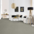 Sol Sisal - Minimal - Gris métallique dans une pièce avec canapé blanc, table basse et plantes vertes