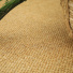 Sol Sisal - Crafted - Malt avec détail du tissage près d'un panier tressé