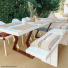 Tissé plat aspect naturel - Backstage - Biscuit habillant une terrasse avec mobilier blanc et table en bois contemporain
