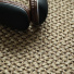 Sol Sisal - Grâce - Cordage avec casque audio posé sur un tissage en fibres naturelles aux nuances cordage